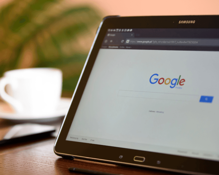 Tablet showing the Google search page, representing online search and search engine optimization.