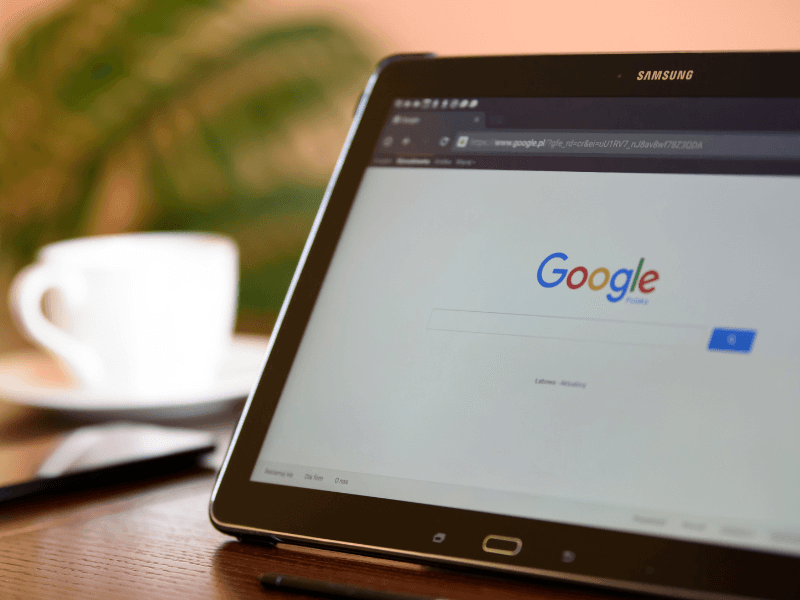 Tablet showing the Google search page, representing online search and search engine optimization.