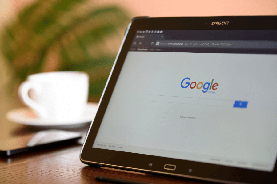 Tablet showing the Google search page, representing online search and search engine optimization.